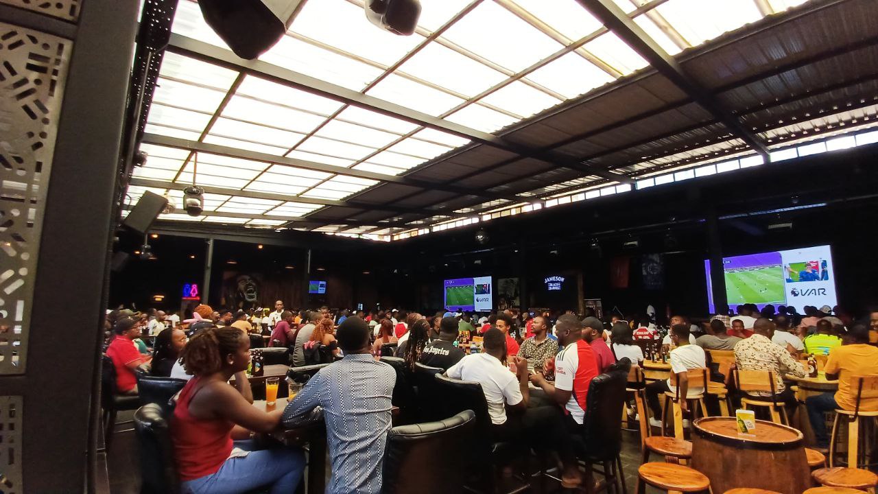 crowd-watching-football-match-in-sports-bar