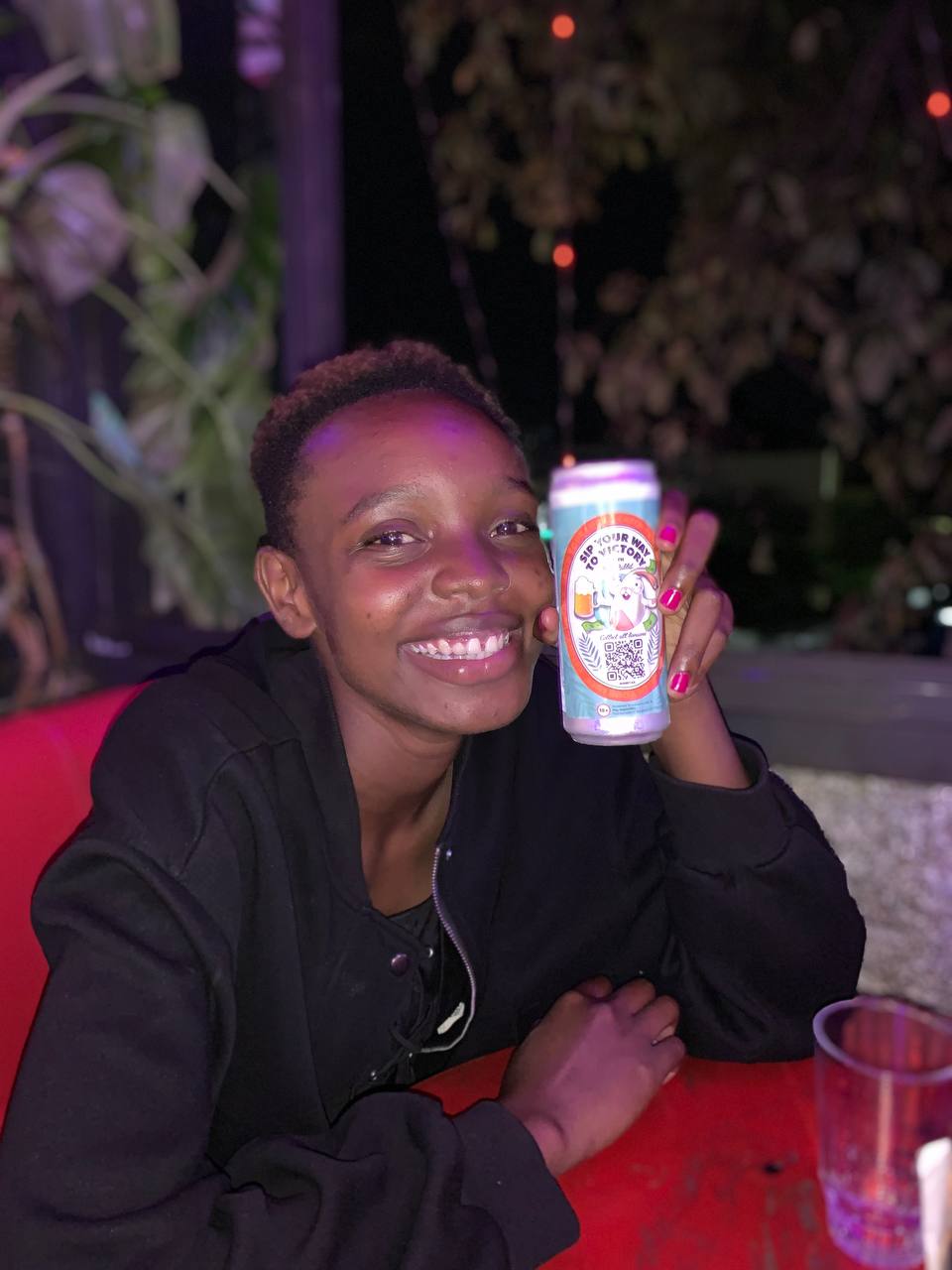smiling-woman-holding-promotional-beverage-can